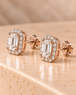 Side view of emerald halo diamond stud earrings in rose gold