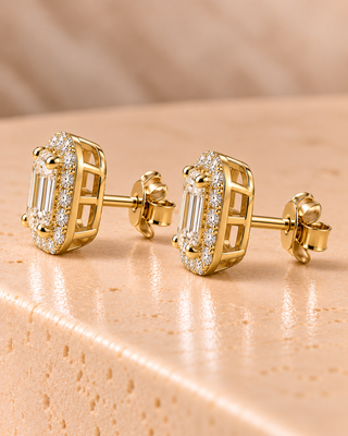 Side view of emerald halo diamond stud earrings in yellow gold
