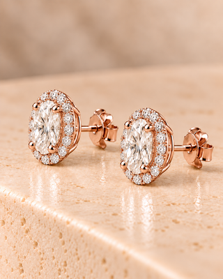 Side view of oval halo diamond stud earrings in rose gold