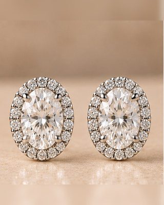 Front view of oval halo diamond stud earrings in white gold