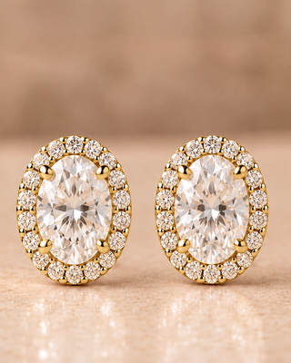 Front view of oval halo diamond stud earrings in yellow gold