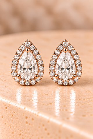 Front view of pear halo diamond stud earrings in rose gold