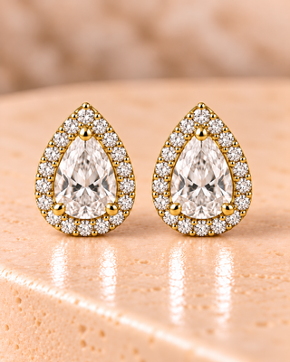 Front view of pear halo diamond stud earrings in yellow gold