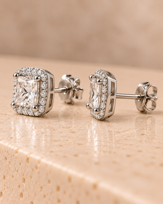 Side view of princess halo diamond stud earrings in white gold