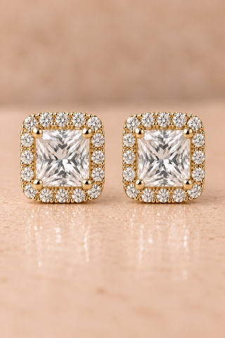 Front view of princess halo diamond stud earrings in yellow gold